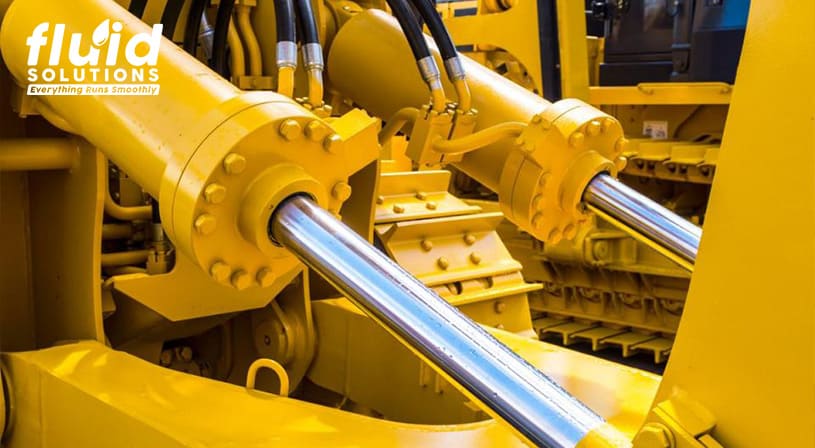 Hydraulic cylinders on heavy machinery.