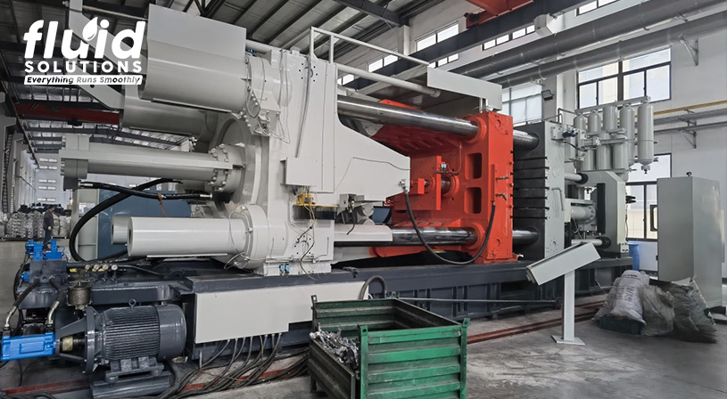 "Large industrial injection molding machine in a factory setting