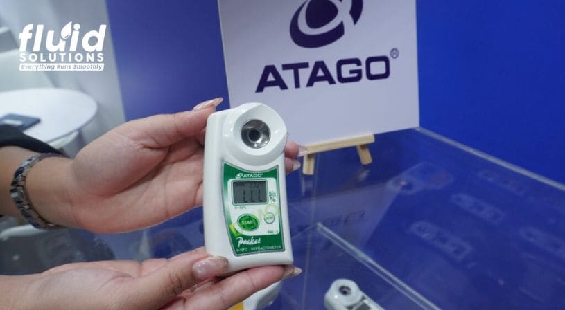 Close-up of an ATAGO refractometer on display at the Fluid Solutions booth.