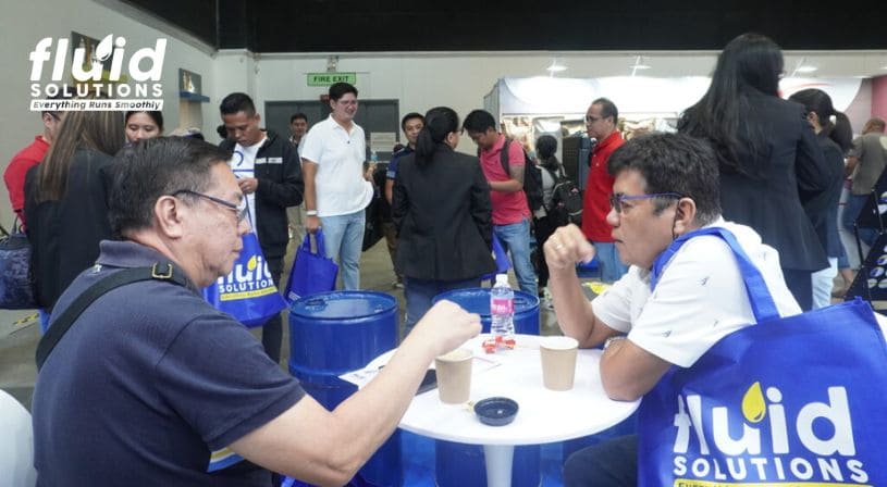 attendees discussion on fluid solutions booth