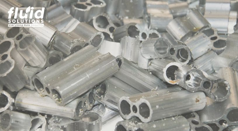 Piles of cut metal tubes with various hollow shapes