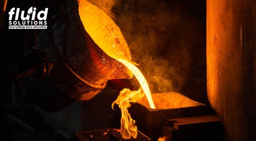 Molten metal being poured from a crucible into a mold