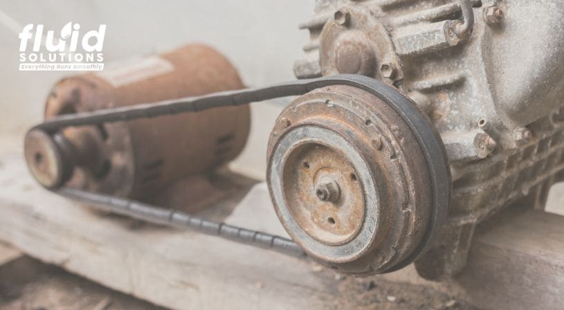 Old rusty motor with a belt drive system, highlighting the need for maintenance