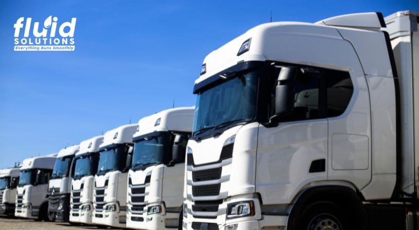 Row of white semi-trucks parked