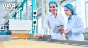 Personnel checking food grade lubricants on machine