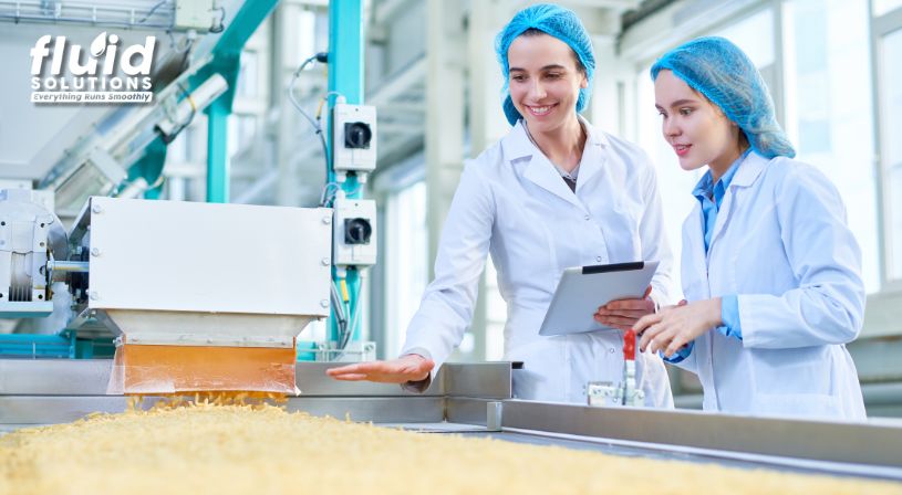 Personnel checking food grade lubricants on machine