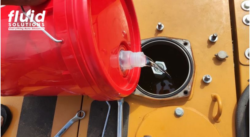 Hydraulic fluid poured in heavy equipment