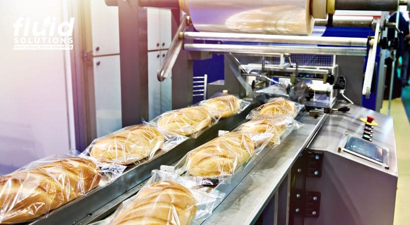 Automated bread packaging line in food manufacturing.