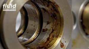 Bearing sludge deposits showing lubricant degradation and maintenance issues