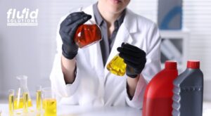Technician testing oil samples in lab
