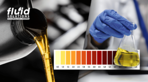 Close-up of oil being poured alongside laboratory flask testing with viscosity color scale chart, representing fluid analysis and quality control in industrial applications
